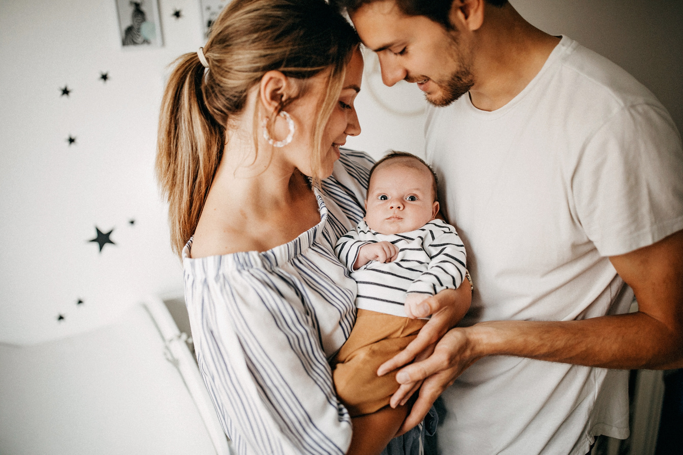 Parents holding their baby